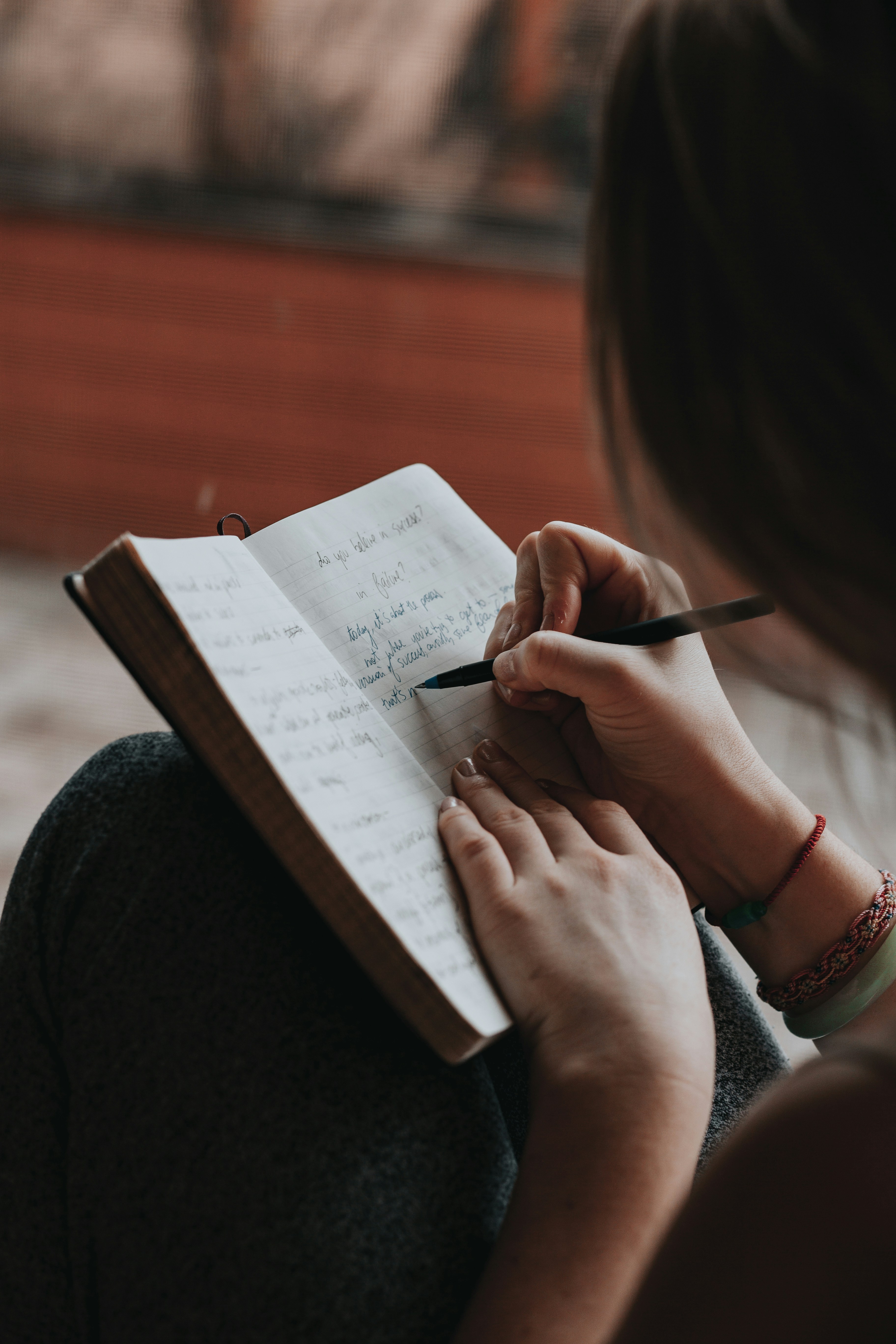 Person writing in journal